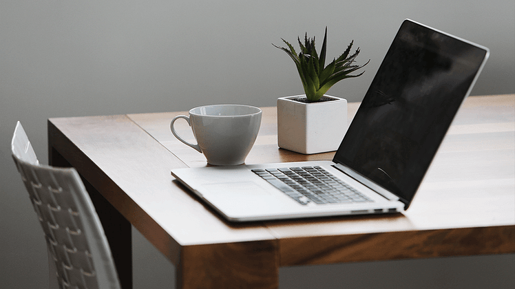Auto-create Featured Image Using Post Title 1 mac compture and a cup on top of table